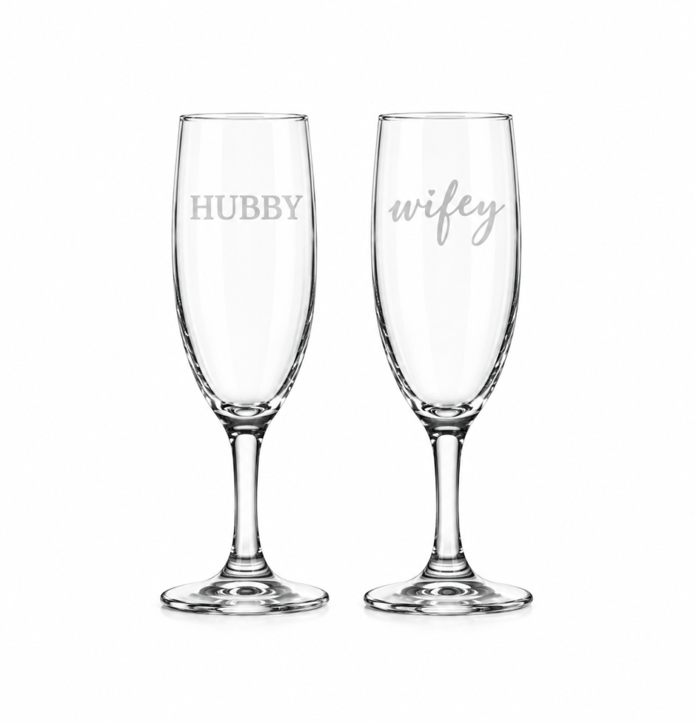 Pair of elegant Hubby and Wifey champagne glass flutes for weddings and anniversaries in Lagos, Nigeria