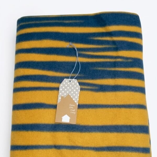Soft dark blue fleece blanket with oblique line patterns for cozy home decor in Lagos, Nigeria