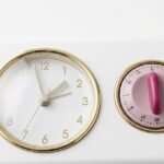 Vintage burgundy red kitchen clock with built-in timer for retro wall styling in Lagos, Nigeria
