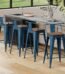 Blue powder-coated cubic metal chair (42cm) with industrial design for home and cafe seating in Lagos, Nigeria.