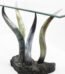 Luxury console table featuring four curved faux horns supporting a glass top on a dark base in Lagos, Nigeria
