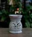 Pale soapstone oil burner with spiral carving for aromatherapy décor in Lagos, Nigeria