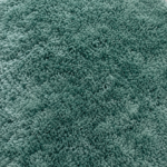 Light orange room rug with blue, black, and green geometric patterns for home flooring in Lagos, Nigeria