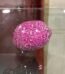 Handcrafted pink glass mosaic lemon ornament with a reflective finish for home and office decor in Lagos.