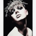 Monochrome fashion wall art featuring a model wearing a dramatic metallic spike headband in Lagos, Nigeria.