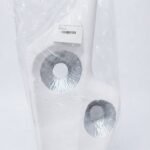 White textured abstract vase with metallic silver circular cutouts for modern table decor in Lagos, Nigeria