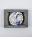 Interlocking lilac and white Black Iris Fragranced Ying and Yang Tea Light Holders on a table in Lagos, Nigeria