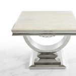 Cream composite marble side table with chrome U-shaped base for luxury living room decor in Lagos, Nigeria.