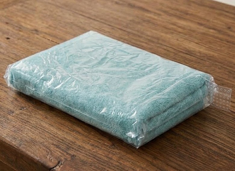 Thick 600GSM signature cotton bath towel in assorted colors for luxury bathroom use in Lagos, Nigeria.