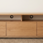 Wooden TV unit with storage shelves and modern design for living room setup in Lagos, Nigeria