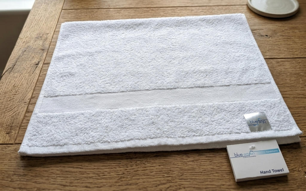 Premium white cotton hand towel from the Premier Collection for luxury bathroom decor in Lagos, Nigeria