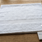Premium white cotton hand towel from the Premier Collection for luxury bathroom decor in Lagos, Nigeria
