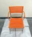 Orange stacking chair with chrome frame durable plastic seat for dining or events Lagos Nigeria