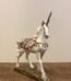 Elegant standing unicorn figurine with a smooth white finish for mythical home decor in Lagos, Nigeria.
