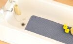Grey bath mat 43 × 91 cm with plush absorbent texture for bathroom floor in Lagos, Nigeria
