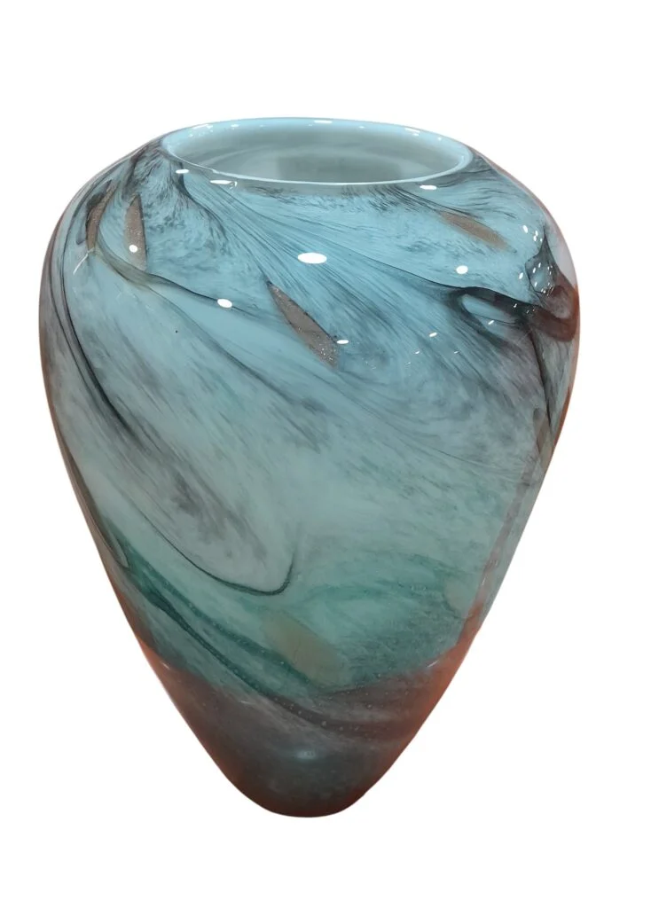 Elegant glass and ceramic vases displayed with flowers on a modern table in Lagos, Nigeria