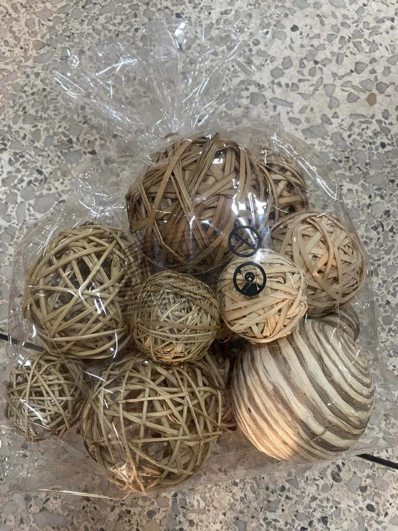 Assorted decorative balls in a modern bowl on a living room table in Lagos, Nigeria