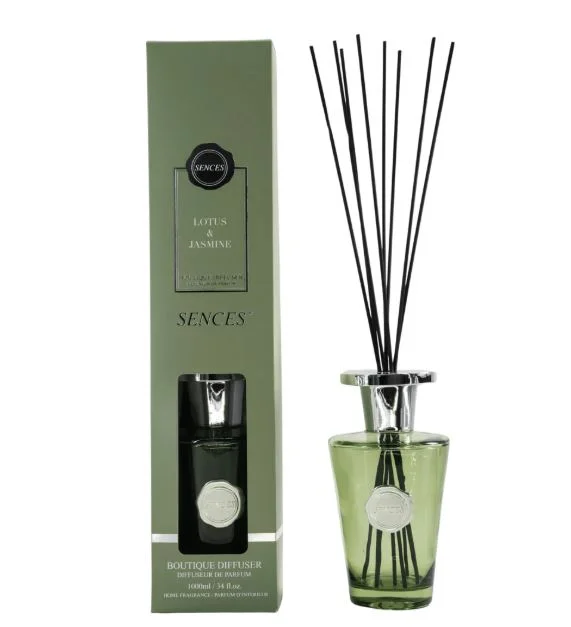 Elegant reed diffuser releasing fragrance in a modern Lagos home interior with natural wooden decor