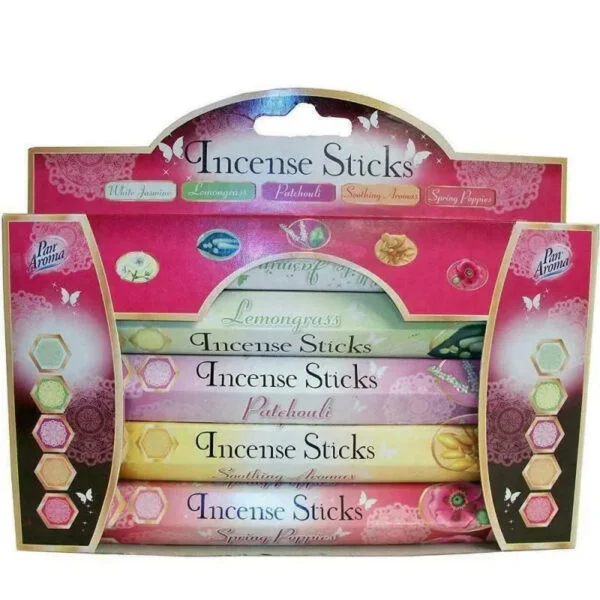 Incense sticks burning with soft smoke in a calm Lagos home interior creating a relaxing atmosphere