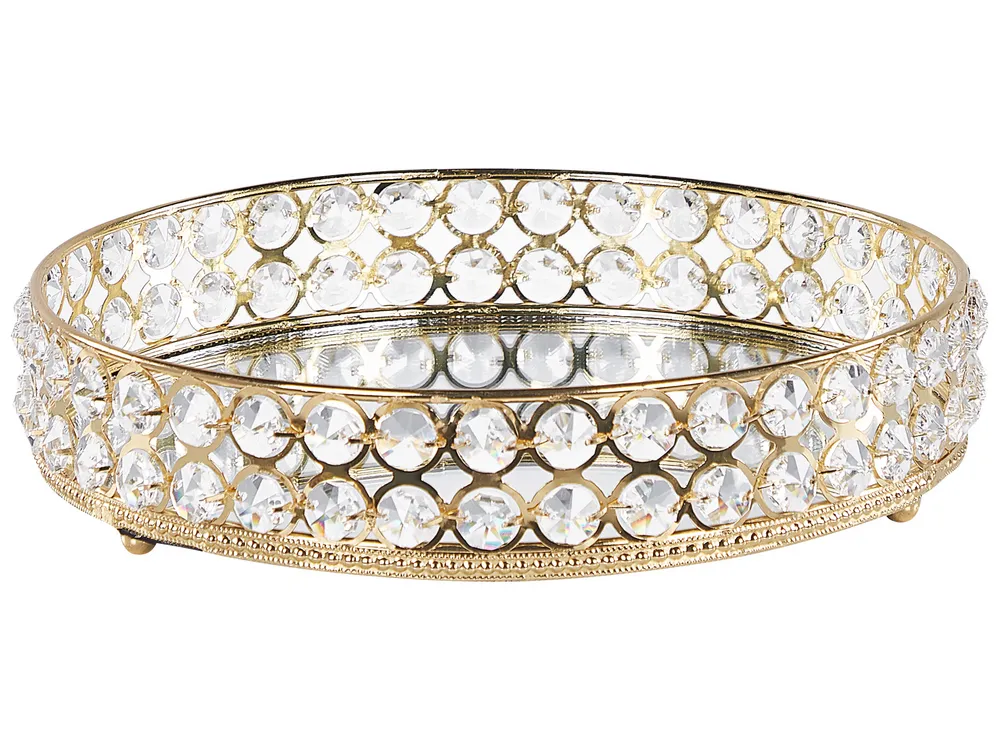 Elegant decorative trays holding candles and vases on a coffee table in a Lagos home