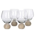 Set of four gold stemless drinking glasses for dining in Lagos Nigeria