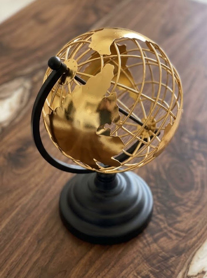 Gold and black steel world globe table décor Gold and black steel world globe table décor for home and office styling in Lagos, Nigeria